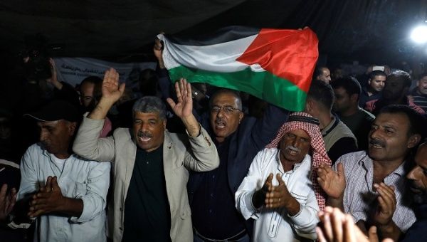 People celebrate after Israel delays eviction of the Palestinian Bedouin village of Khan al-Ahmar, in the occupied West Bank Oct. 20, 2018. 