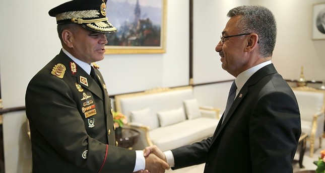 Vice President Fuat Oktay (right) welcomes Venezuelan Defense Minister Vladimir Padrino Lopez in Ankara Monday.
