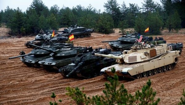 U.S., German, Spanish and Polish troops of the NATO enhanced Forward Presence battle goups with their tanks get ready for the Iron Tomahawk exercise in Adazi, Latvia.