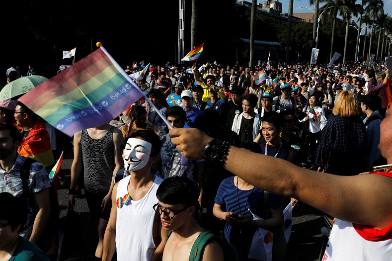 The parade featured colorful costumes, musical performances and rainbow flags as protesters gathered near the Presidential Office.
