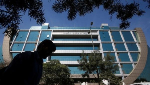 A man walks past India's Central Bureau of Investigation (CBI) headquarters building in New Delhi, India, March 6, 2018.