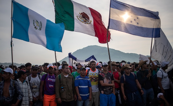 A caravan of thousands of migrants from Central America, en route to the United States, pauses as it makes its way to San Pedro Tapanatepec from Arriaga, Mexico October 27, 2018