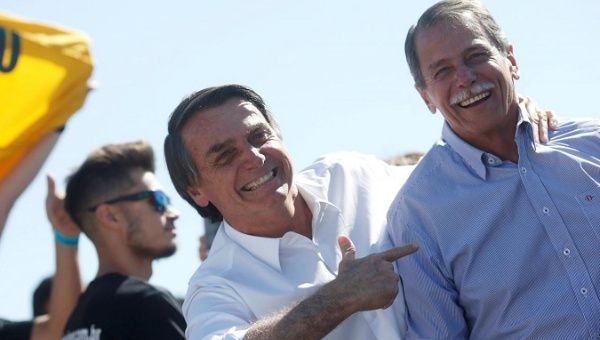Presidential candidate Jair Bolsonaro (L) and Paulo Chagas, retired General of the Brazilian Army, attend a rally in Taguatinga near Brasilia, Brazil September 5, 2018. 