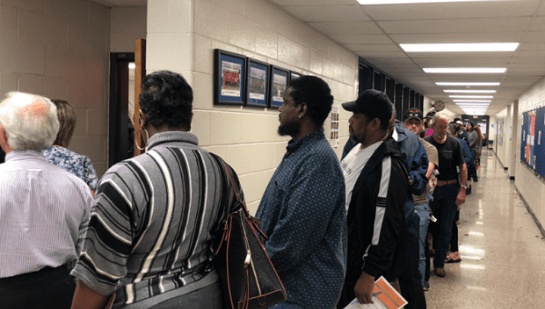 Voters waiting in line in Georgia due to faulty voting machines.