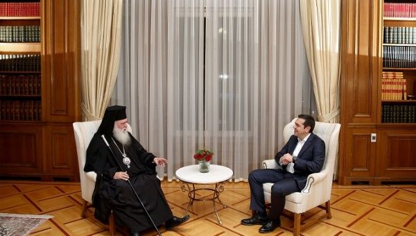 Greek Prime Minister Alexis Tsipras meets with leader of the Greek church Archbishop Ieronimos at his office in the Maximos Mansion in Athens