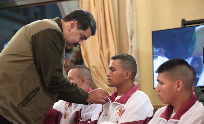 President Nicolas Maduro attends an event, with wounded soldiers, at the Miraflores Palace, Caracas.