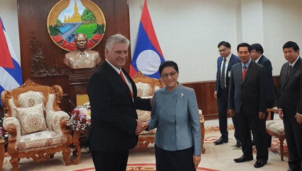 Pany Yathotou, president of the National Assembly of Laos (R) greeting Cuban President Diaz-Canel. 