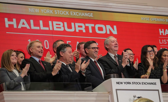 Halliburton's president and CEO Jeff Miller, and executive chairman Dave Lesar ring the opening bell with other corporate management at the NYSE in New York.