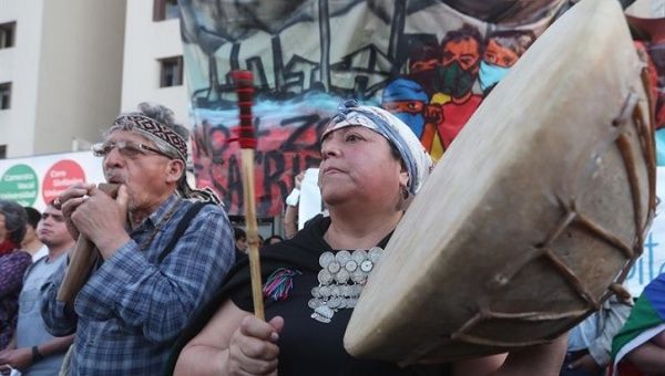 Indigenous people protesting the murder of Mapuche member by Carabineros. 