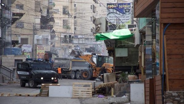 Israeli bulldozers entered the Shu'fat refugee camp in the occupied East Jerusalem to destroy Palestinian businesses. 