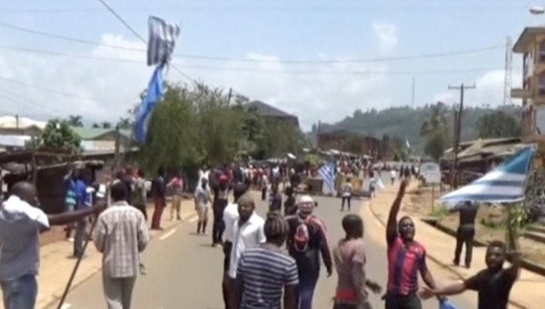A still image taken from a video shot on October 1, 2017, shows protesters waving Ambazonian flags in Cameroon. 
