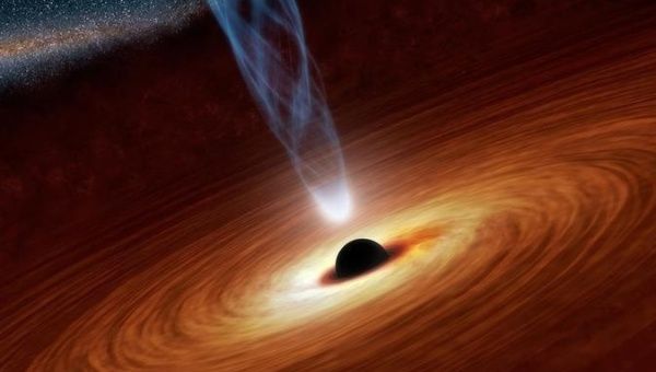 A black hole 14 million light-years away gives scientists a brief glimpse into the nature of the astronomical enigma.