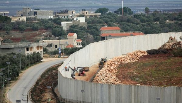 Israeli forces continue construction on a wall on the Israeli - Southern Lebanon border.