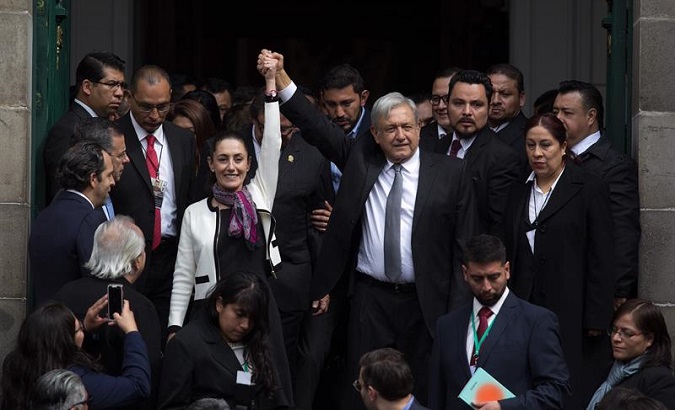 Sheinbaum holds hands with Lopez Obrador after her swear in ceremony on Wednesday in Mexico City.