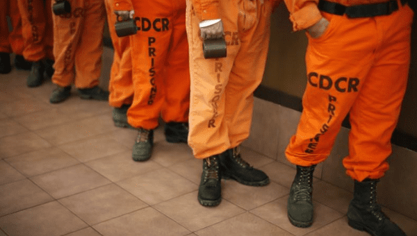 Prison inmates wearing firefighting boots at Oak Glen Conservation Fire Camp Yucaipa, California November 6, 2014.