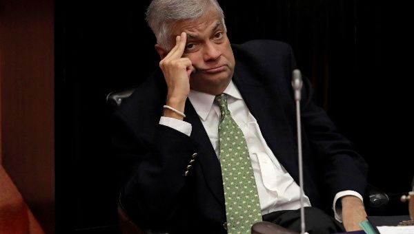 Sri Lanka's ousted Prime Minister Ranil Wickremesinghe looks on during a parliament session Dec 5.