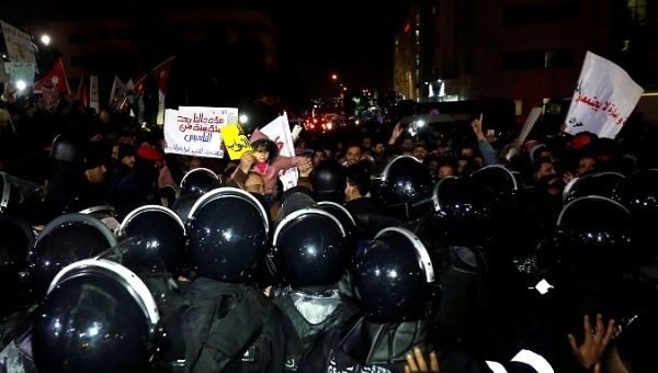 Jordanian girl facing down riot police in protests over austerity