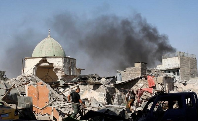 Members of Iraqi Counter Terrorism Service sift through the ruins of the Grand al-Nuri Mosque at the Old City in Mosul, Iraq June 29, 2017.