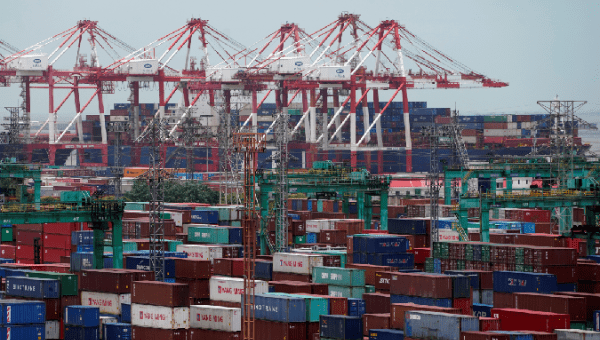 Shipping containers are seen at a port in Shanghai, China July 10, 2018. REUTERS/Aly Song
