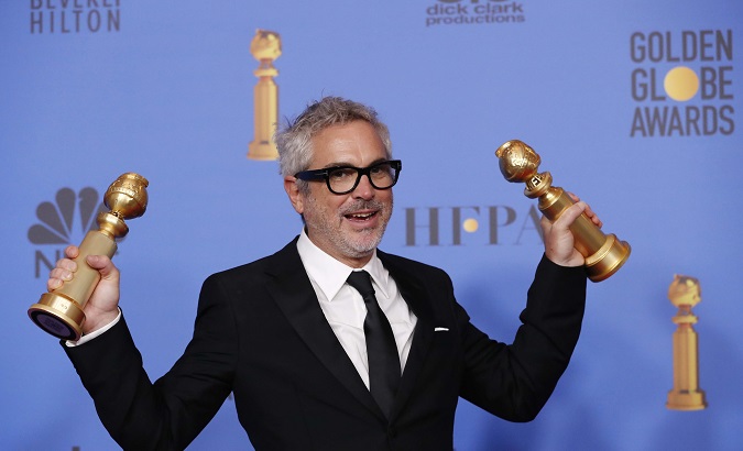 Alfonso Cuaron poses backstage with his Best Director - Motion Picture and Best Motion Picture - Foreign Language for 