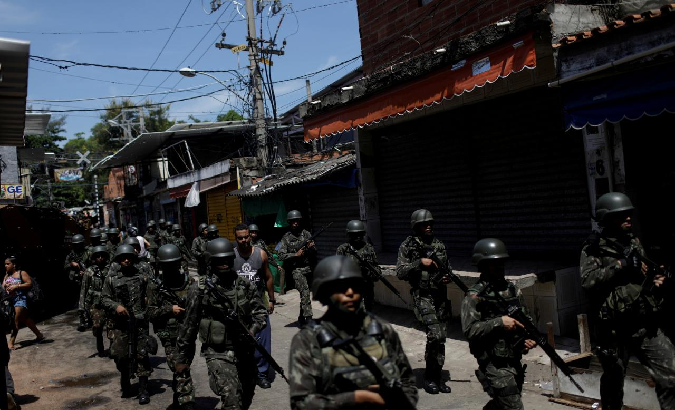 Armed Forces members patrol in Jacarezinho slum during an operation against drug gangs in Rio de Janeiro, Brazil January 18, 2018