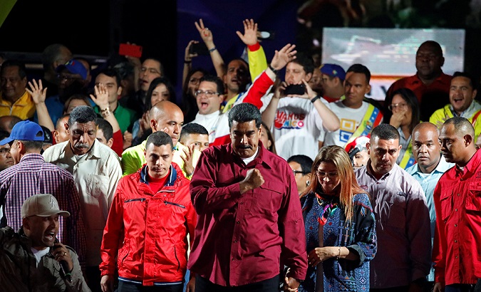 Venezuela's President Nicolas Maduro stands with supporters during a gathering after the results of the election were released, outside of the Miraflores Palace in Caracas, Venezuela, May 20, 2018.
