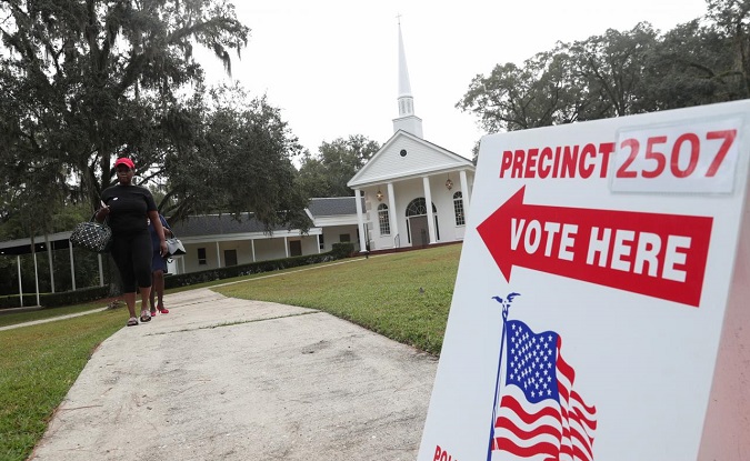 Voters leave a polling station during the midterm election in Tallahassee, Florida, U.S., November 6, 2018.