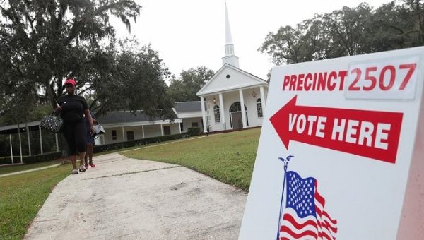 Voters leave a polling station during the midterm election in Tallahassee, Florida, U.S., November 6, 2018. 