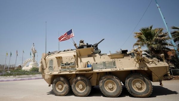 A U.S military vehicle travels in the town of Amuda, northern Syria April 29, 2017.