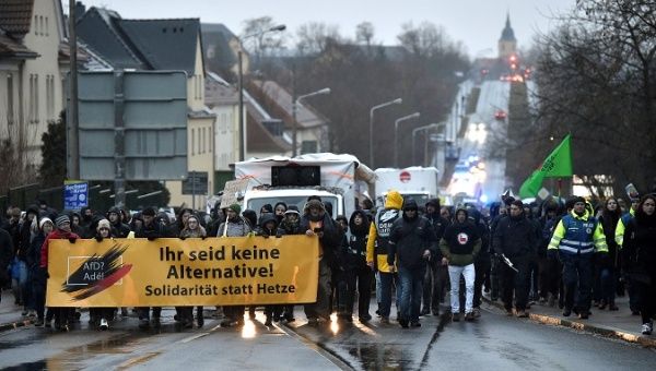 Anti-AfD protesters march during Alternative for Germany (AfD) party meeting on the upcoming European election in Riesa, Saxony, Germany, January 12, 2019. Banner reads 