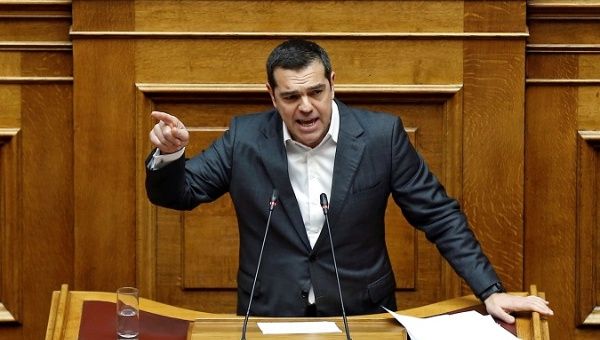 Greek Prime Minister Alexis Tsipras addresses lawmakers during a parliamentary session on confidence vote in Athens, Greece, Jan. 15, 2019. 