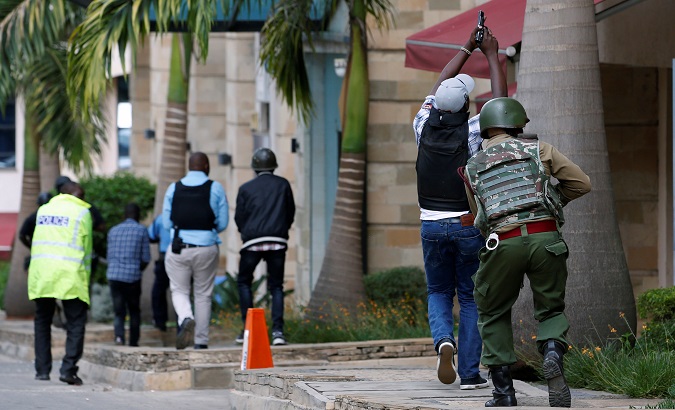 Members of security forces are seen at the scene where explosions and gunshots were heard at the Dusit hotel compound, in Nairobi, Kenya Jan. 15, 2019.