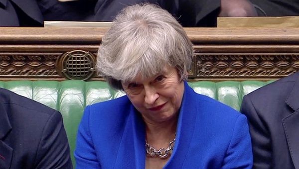 British Prime Minister Theresa May reacts as Jeremy Corbyn speaks, after she won a confidence vote, after Parliament rejected her Brexit deal, in London, Britain, January 16, 2019.