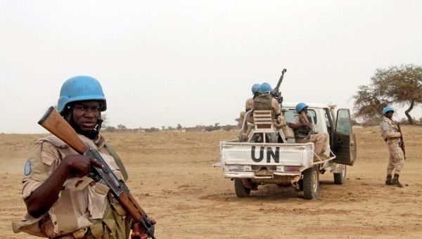 UN peacekeepers stand guard in the northern town of Kouroume, Mali, May 13, 2015.