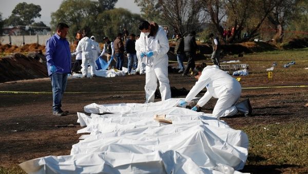 Forensic technicians tag bodies at the site where a fuel pipeline exploded, in the municipality of Tlahuelilpan, state of Hidalgo, Mexico Jan. 19, 2019. 