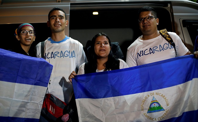 Catholic pilgrims hold a national Nicaraguan flag before leaving to Panama to participate in the third World Youth Day with Pope Francis, at the Metropolitan Cathedral in Managua, Nicaragua January 20, 2019.