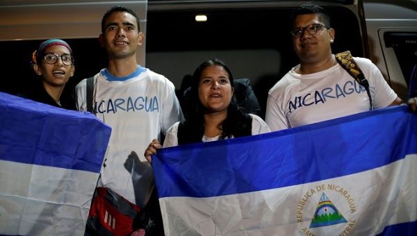 Catholic pilgrims hold a national Nicaraguan flag before leaving to Panama to participate in the third World Youth Day with Pope Francis, at the Metropolitan Cathedral in Managua, Nicaragua January 20, 2019. 