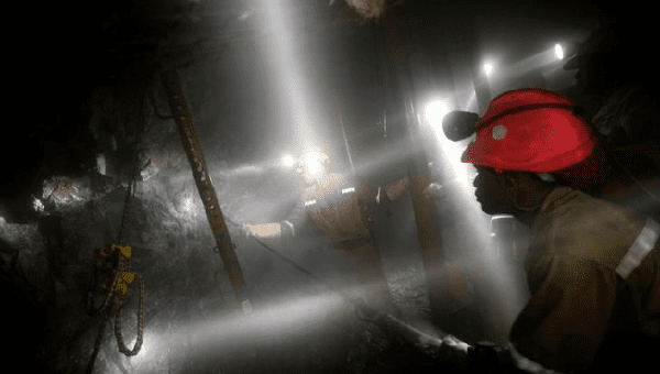 Mine workers employed at Sibanye Gold's Masimthembe shaft operate a drill in Westonaria, South Africa, April 3, 2017. Picture taken April 3, 2017.