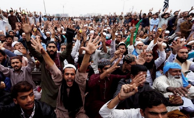 Pakistani men protesting against Asia Bibi, the Christian woman charged with blasphemy.