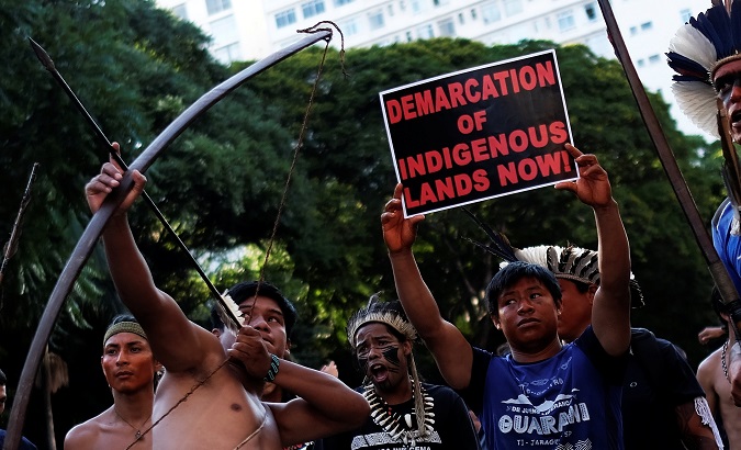 Indigenous men take part in a protest against Brazil President Jair Bolsonaro's administration in Sao Paulo, Brazil, January 31, 2019.