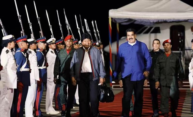 Venezuela President Nicolas Maduro receives his Bolivian counterpart Evo Morales Friday, Feb. 1, 2019.