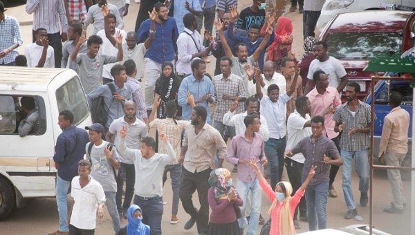 Sudanese demonstrators march during an anti-government protest in Khartoum, Sudan Feb. 7, 2019