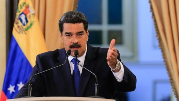 Venezuelan President Nicolas Maduro speaks during a press conference to international media at the presidential palace in Caracas. 