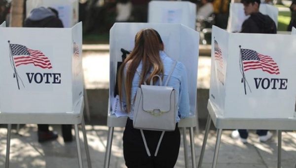 A first time voter casts her ballot during the 2018 midterm elections in the United States.