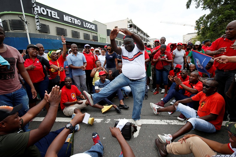 A man dances during a march by members of the Confederation of South African Trade Unions (COSATU) against job losses in Durban, South Africa, February 13, 2019. 