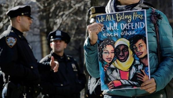A protester holds a sign during a rally in front of the Jacob K. Javits Federal Office Building, New York City, denouncing I.C.E. raids, January 27, 2018.