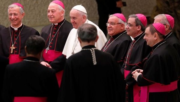 Pope Francis is surrounded by bishops during the weekly general audience at Paul VI hall at the Vatican February 6, 2019.