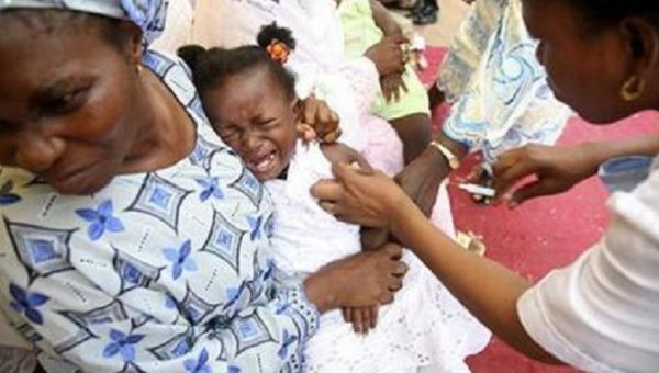 A girl cries as she receives a measles vaccine which is a part of a campaign organised by the World Health Organisation in Lagos December 12, 2008.