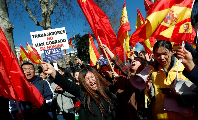 Chinese customers protest outside the BBVA headquarters in Madrid, Spain, Feb. 15, 2019.