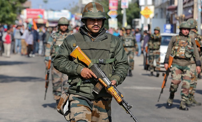 Indian Army soldiers patrol a street during a curfew in Jammu, Feb. 16, 2019.